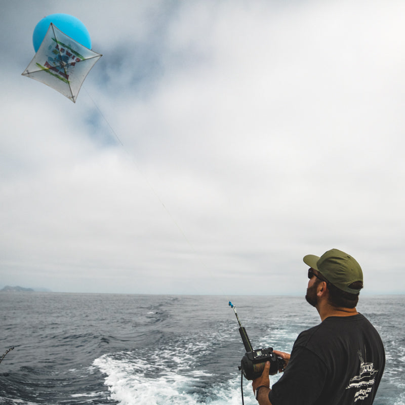 Angler using a Daiwa Tanacom 1200 for offshore kite fishing