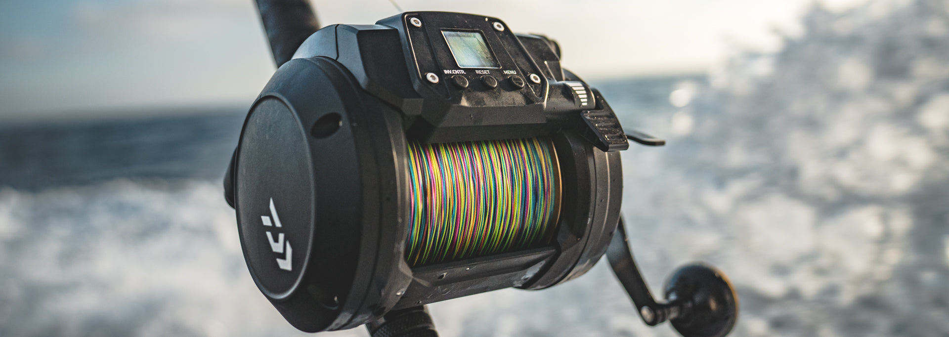 Daiwa Tanacom 1200 loaded with braid mounted on a fishing rod at sea