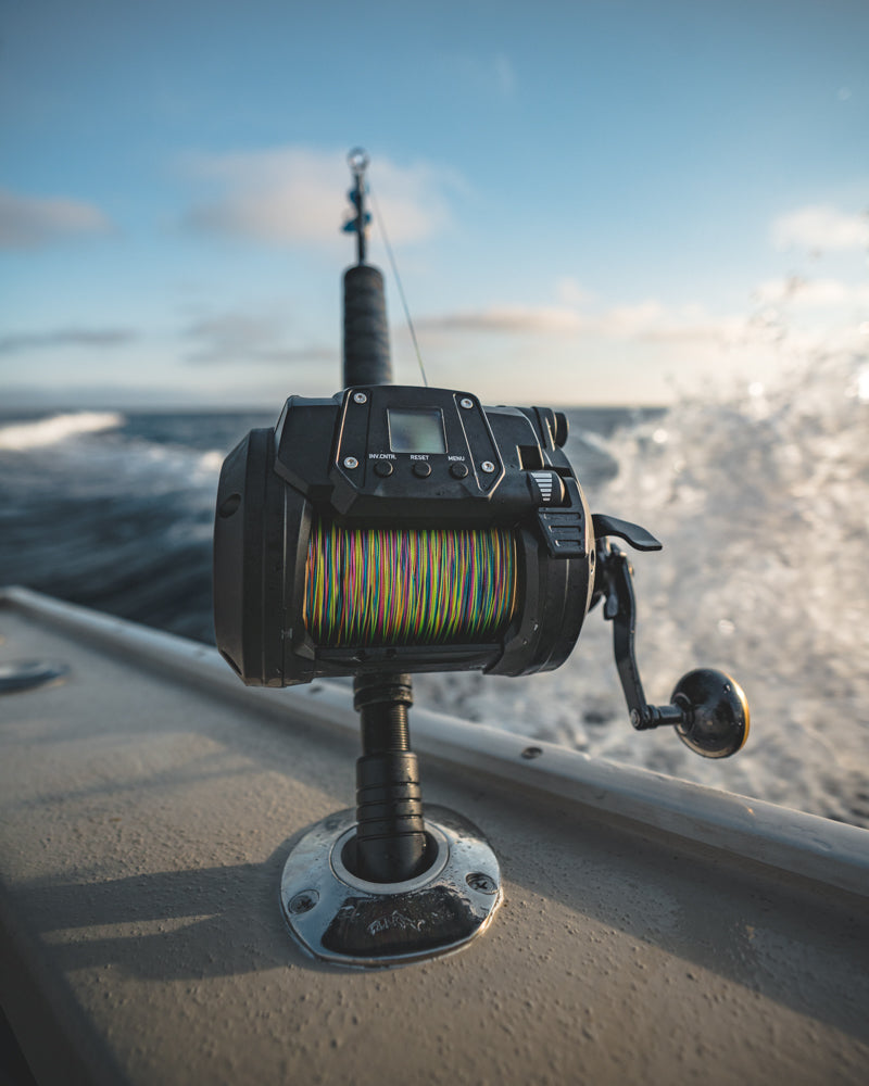 Daiwa Tanacom 1200 mounted in a rod holder on an offshore boat